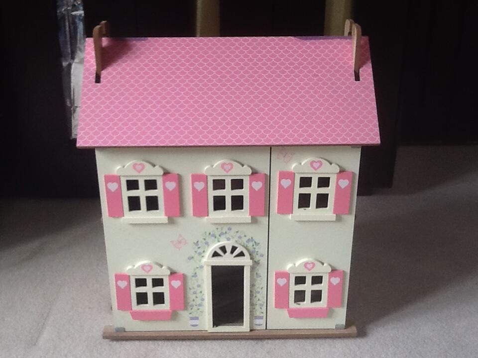 pink and white dolls house